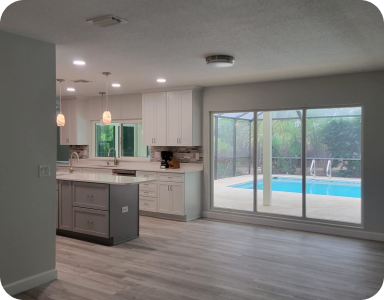 a photo of a kitchen renovation with modern appliances and an island